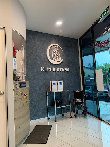 Reception with Klinik Utara logo wall